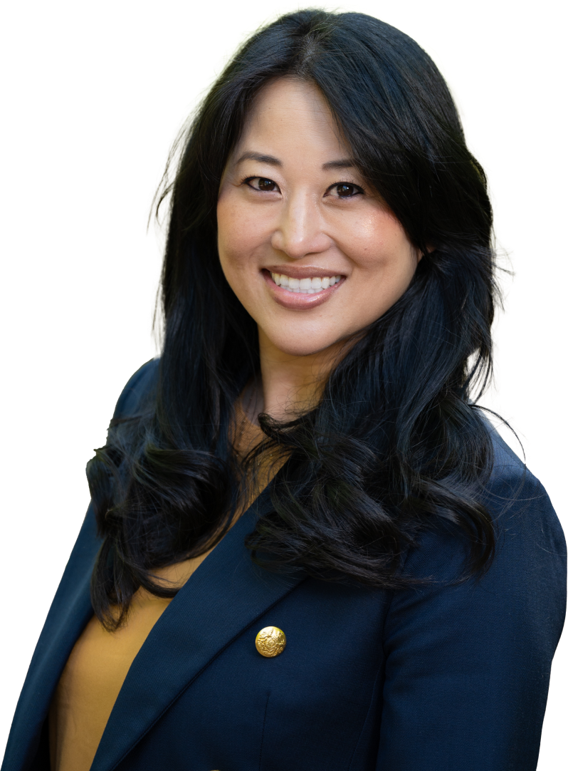 Head shot of Dr. Oh wearing a blue dark blazer and yellow blouse